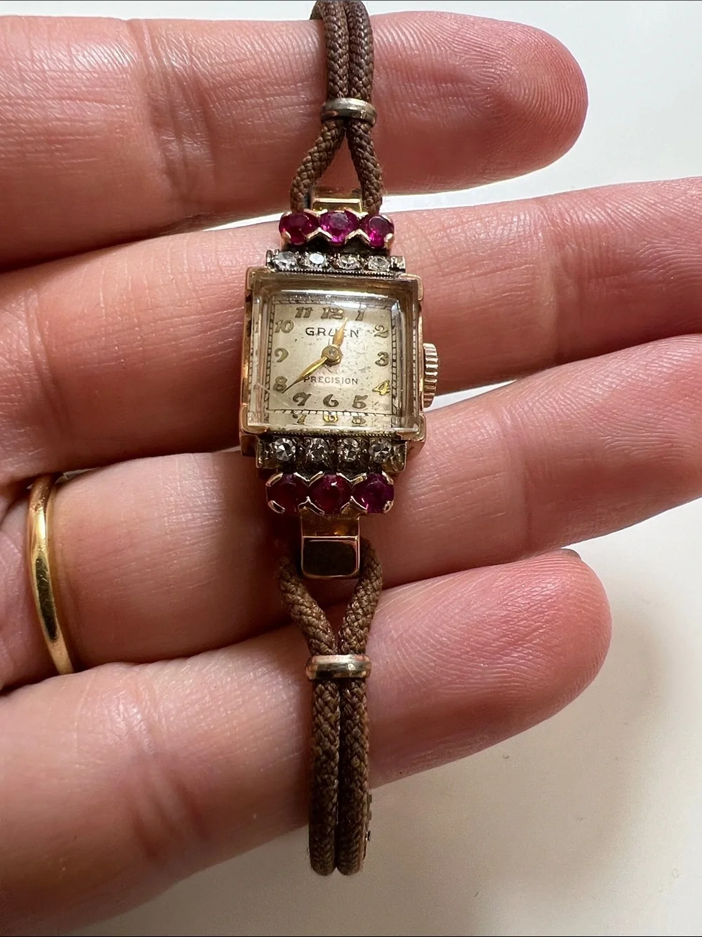Gruen Precision wristwatch crafted in 14k rose gold with rubies and diamonds
